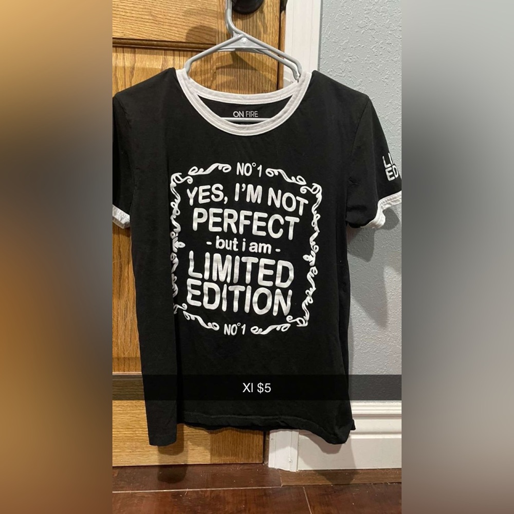 Short sleeve black shirt with lettering.